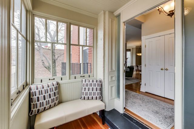 5626 North Ridge Avenue Chicago, IL 60660 - Photo 3 of 27 a living room with furniture and a large window with wooden floor