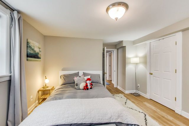 5626 North Ridge Avenue Chicago, IL 60660 - Photo 24 of 27 a bed room with a bed and a window