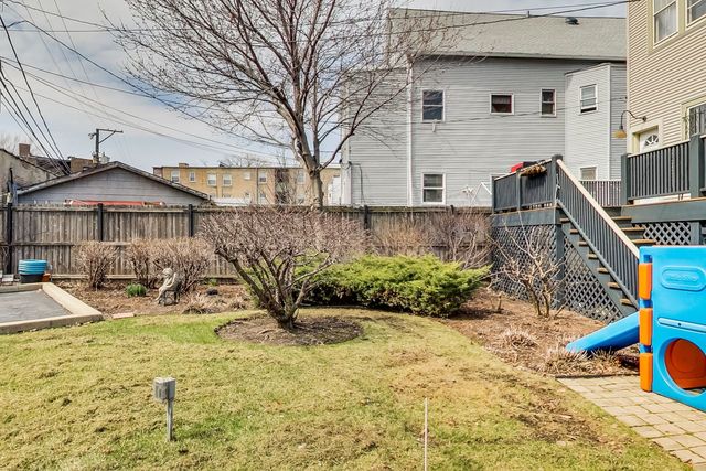 5626 North Ridge Avenue Chicago, IL 60660 - Photo 26 of 27 a view of a house with backyard and sitting area