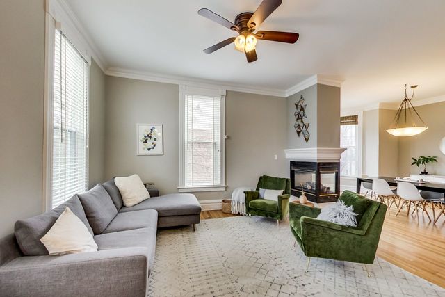 5626 North Ridge Avenue Chicago, IL 60660 - Photo 4 of 27 a living room with furniture a fireplace and a window