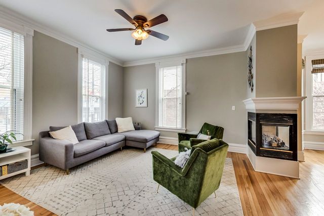 5626 North Ridge Avenue Chicago, IL 60660 - Photo 5 of 27 a living room with furniture and a fireplace