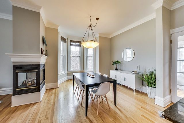 5626 North Ridge Avenue Chicago, IL 60660 - Photo 8 of 27 a view of a dining room with furniture window and wooden floor