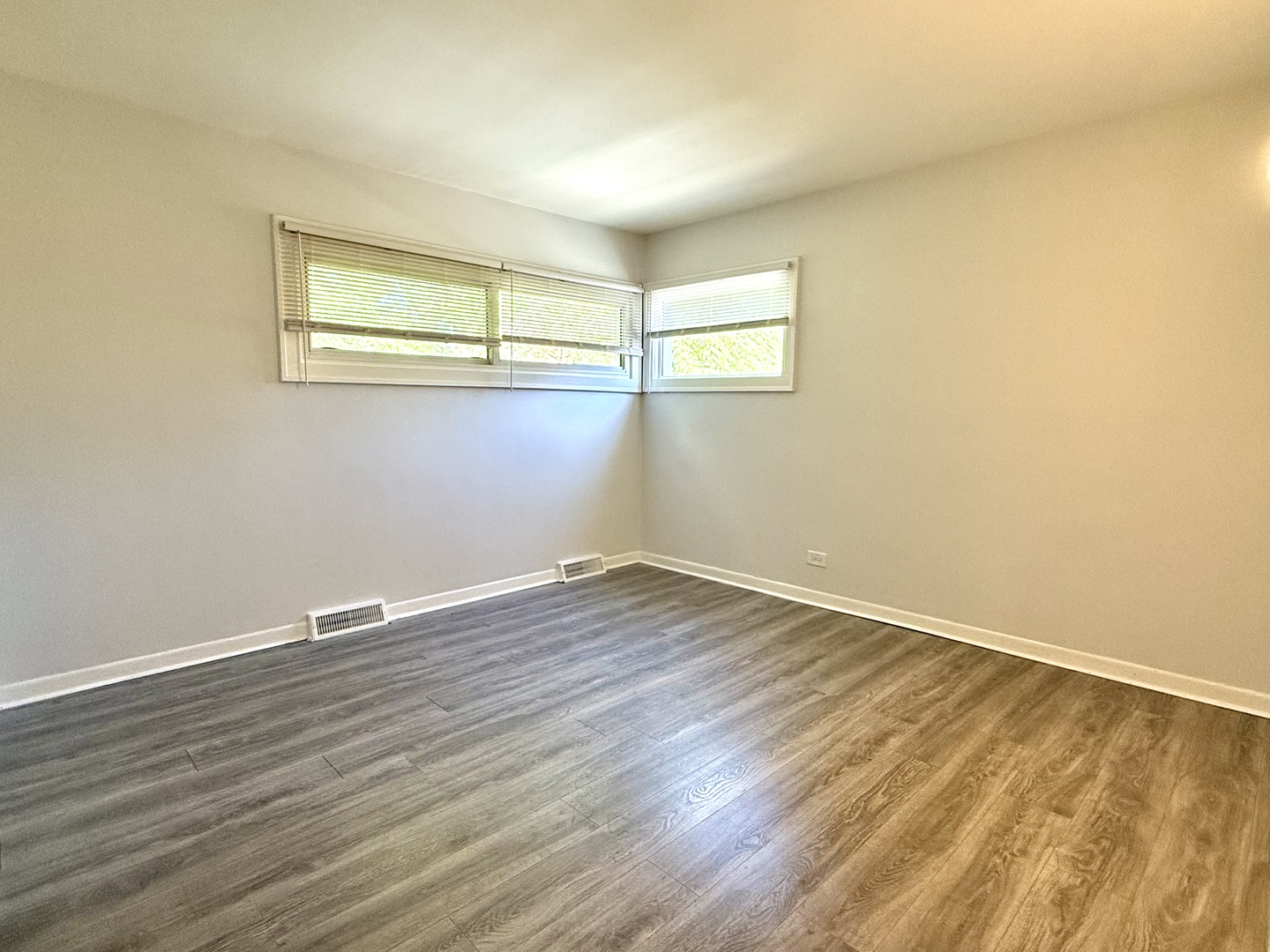 231 Callan Avenue, Unit 2N Evanston, IL 60202 - Photo 7 of 8 a view of a room with wooden floor and fan