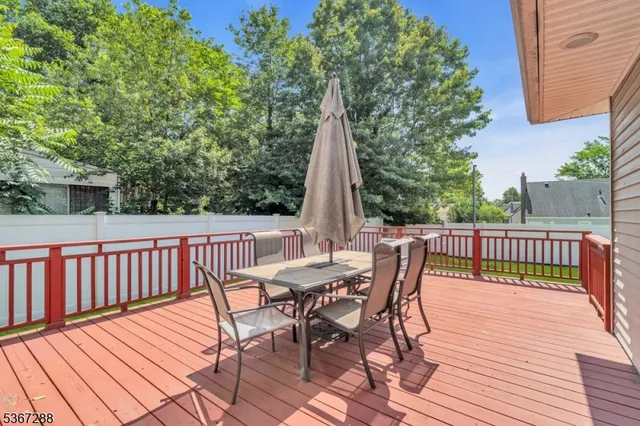 a view of a wooden deck with furniture