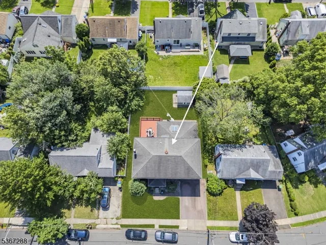 an aerial view of a house with a garden