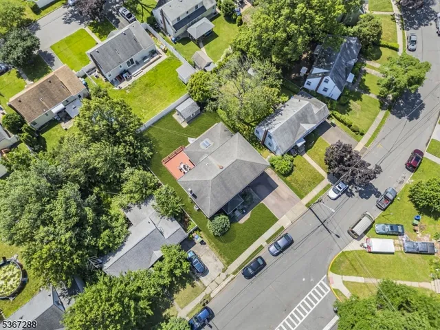 an aerial view of residential house with outdoor space and swimming pool