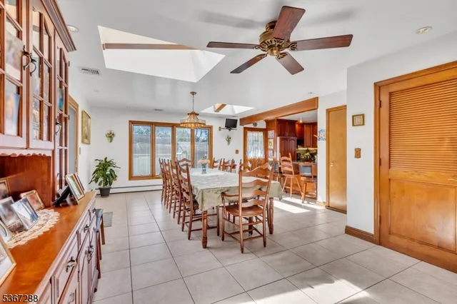 a view of a dining room with furniture and a livingroom