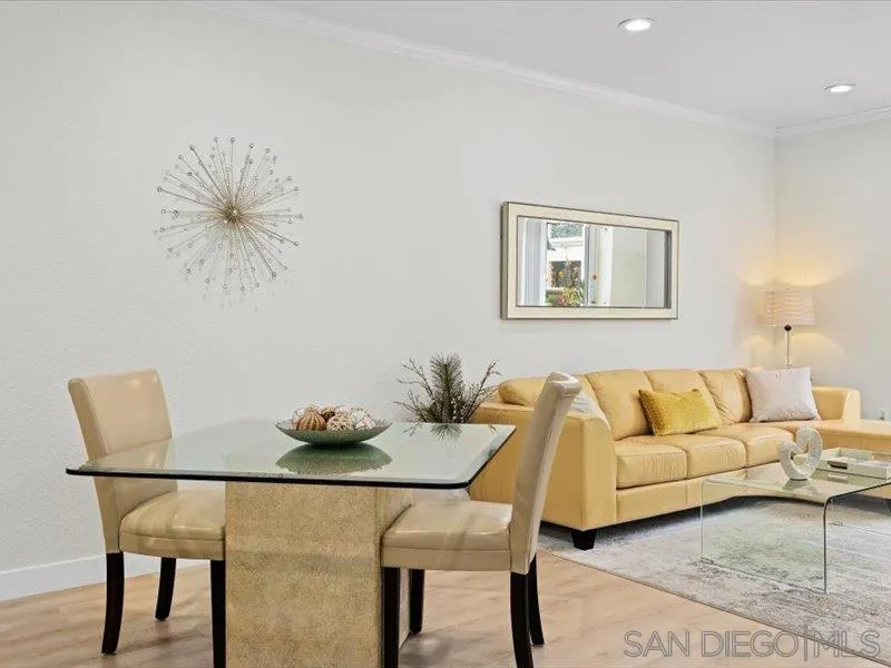 9237 Regents Road, Unit K101 La Jolla, CA 92037 - Photo 7 of 29 a living room with furniture and a table