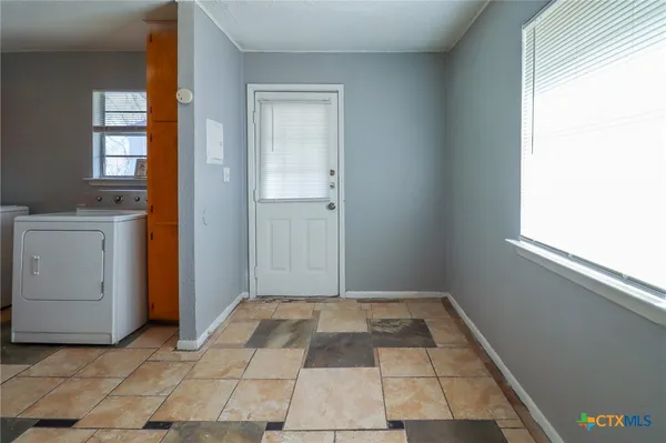 a view of an empty room and window