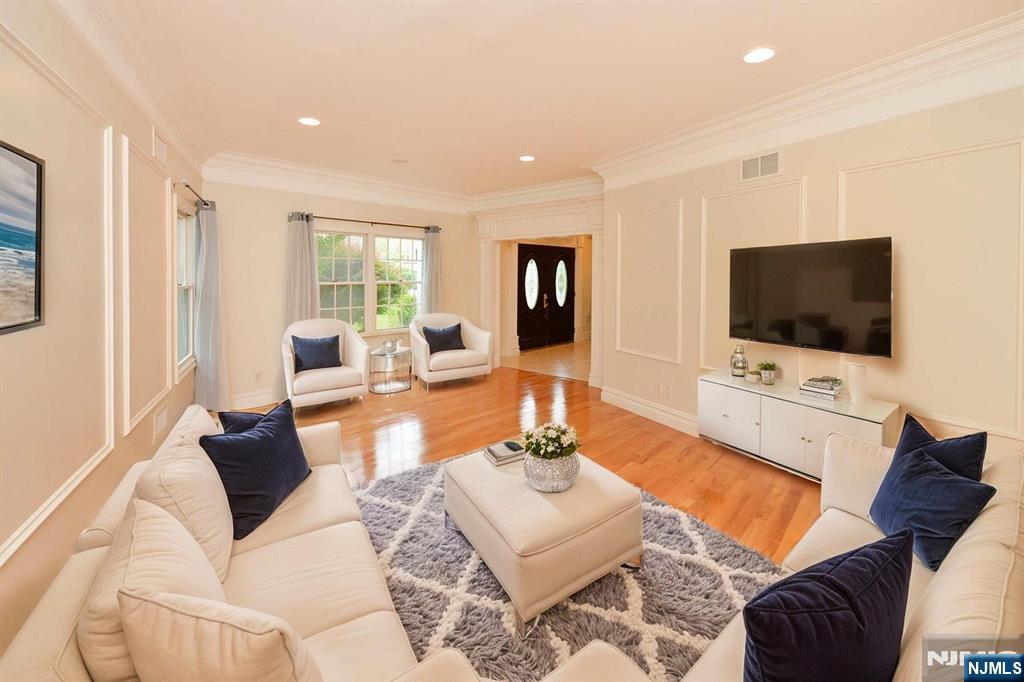 2186 Jones Road Fort Lee, NJ 07024 - Photo 11 of 27 a living room with furniture and a flat screen tv