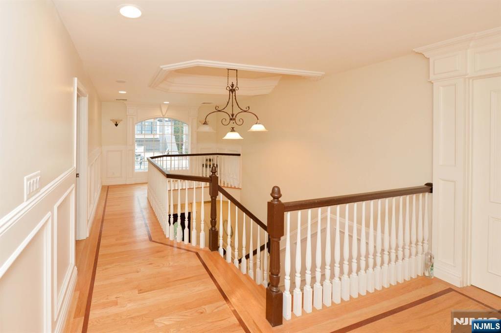 2186 Jones Road Fort Lee, NJ 07024 - Photo 15 of 27 a view of staircase with railing and chandelier