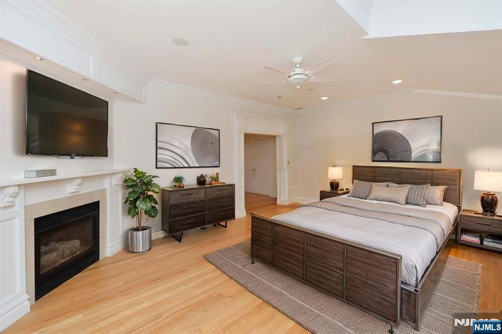 2186 Jones Road Fort Lee, NJ 07024 - Photo 17 of 27 a bedroom with a bed and a flat screen tv