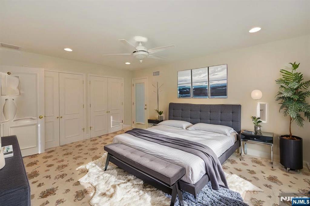 2186 Jones Road Fort Lee, NJ 07024 - Photo 21 of 27 a bed room with a bed and a couch