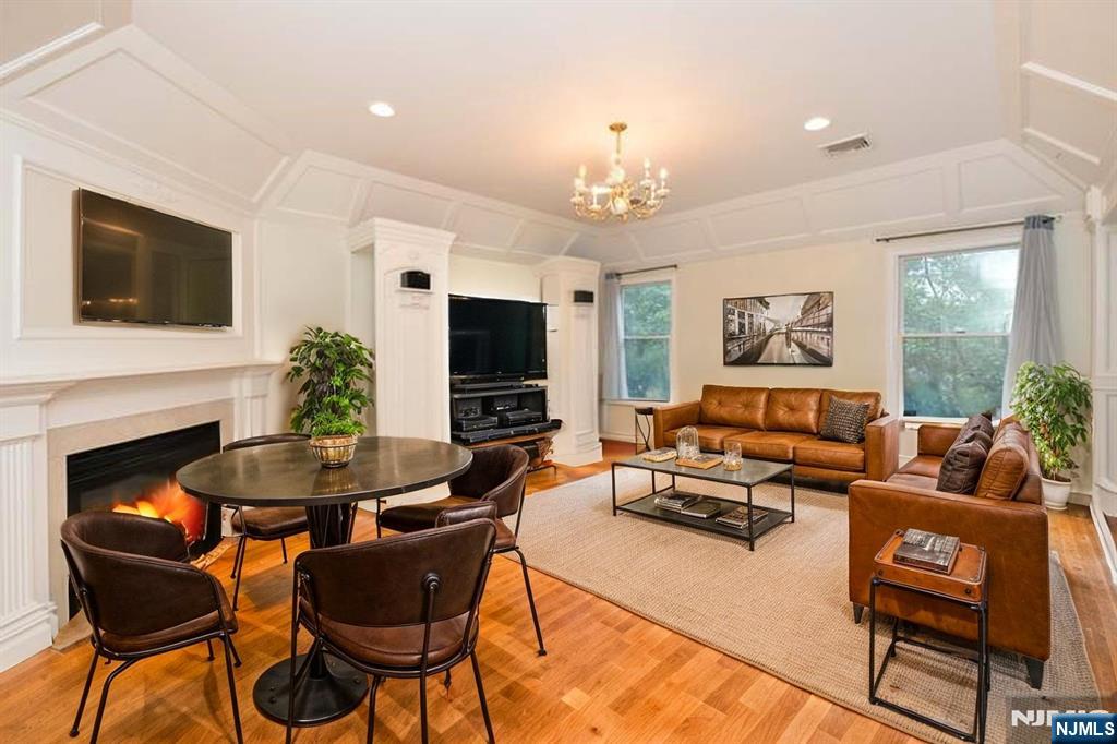 2186 Jones Road Fort Lee, NJ 07024 - Photo 8 of 27 a living room with furniture a flat screen tv and a fireplace