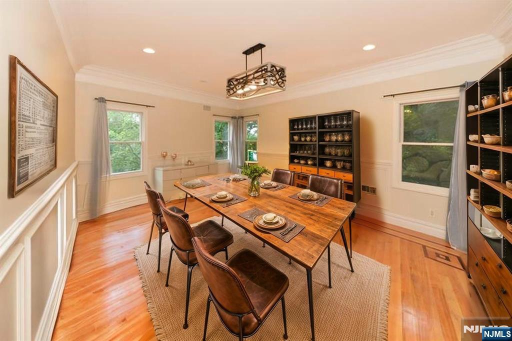 2186 Jones Road Fort Lee, NJ 07024 - Photo 9 of 27 a view of a dining room with furniture window and wooden floor