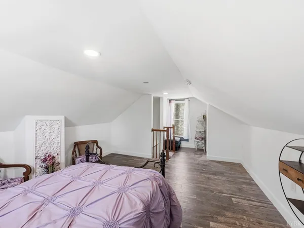a bedroom with a bed and a table