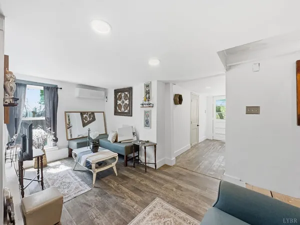 a living room with furniture and a rug