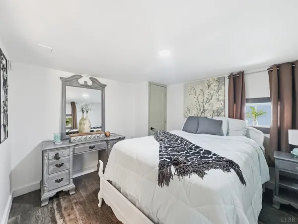 a bedroom with a bed and a dresser