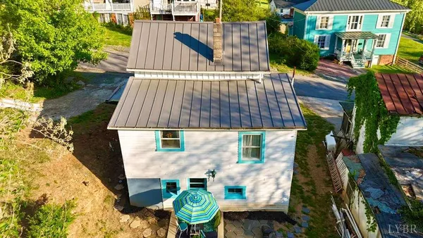 a view of a backyard with sitting area
