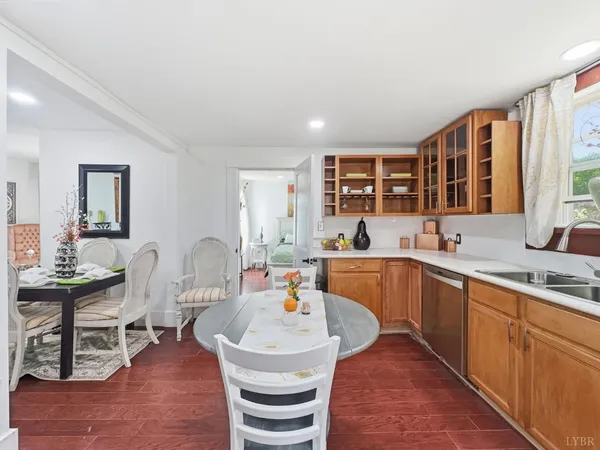 a large kitchen with a table and chairs