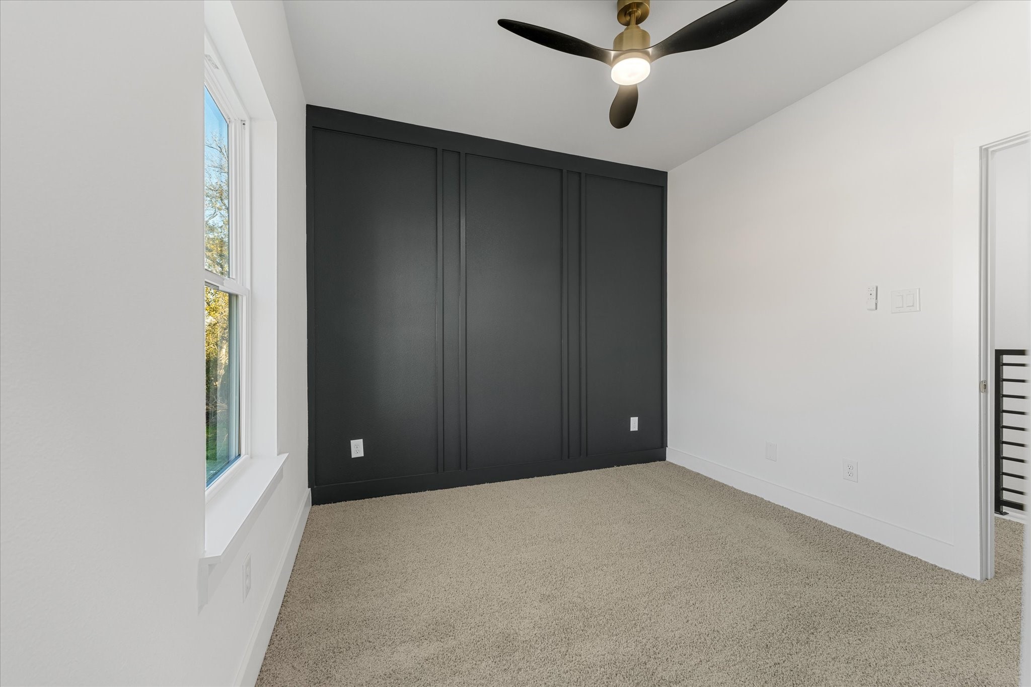 1010 Calvin Street Houston, TX 77088 - Photo 19 of 20 Third bedroom with accent wall. Photos are from builders previously built model, same floor plan and finishes.