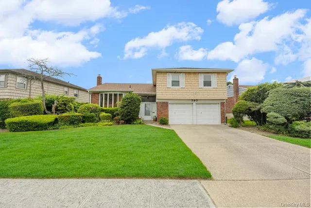 front view of a house with a garden