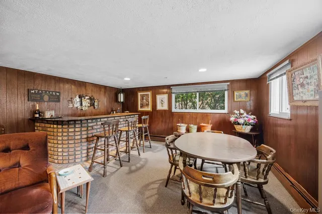 a bedroom with furniture and a chandelier