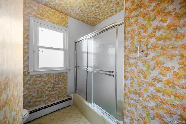 a bathroom with a sink double vanity and a bathtub