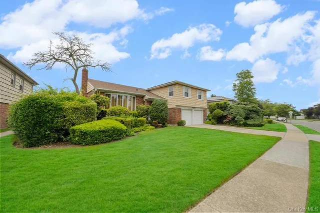 a view of a garden with a house