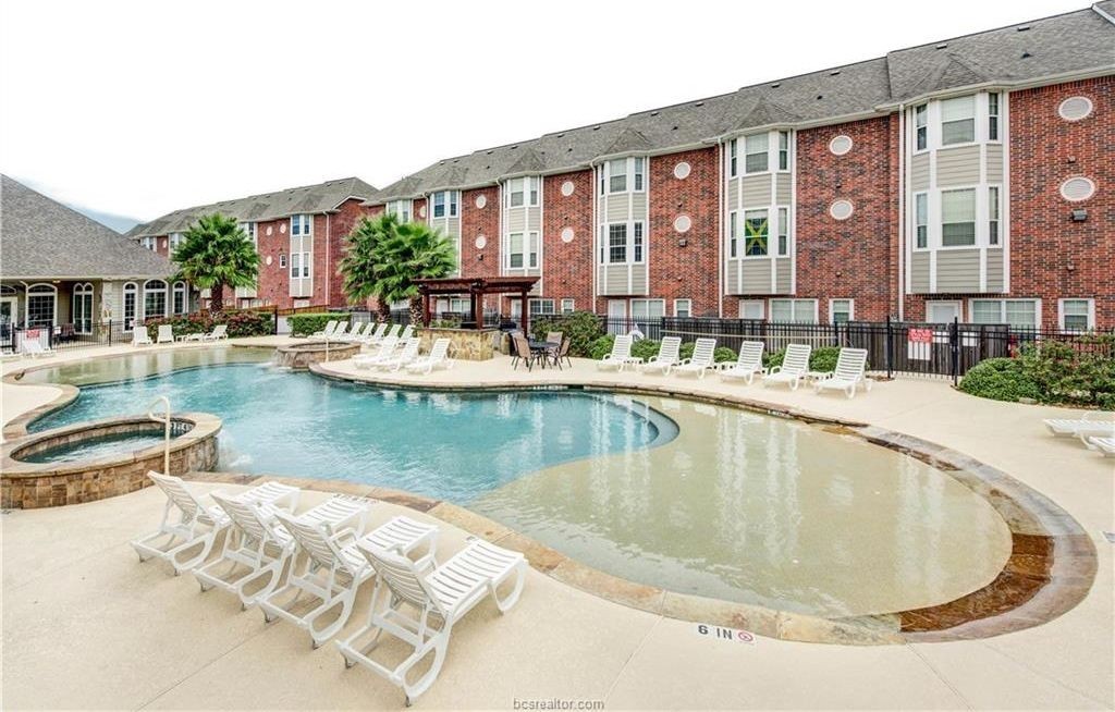 1198 Jones-Butler Road, Unit 602 College Station, TX 77840 - Photo 7 of 10 a view of a swimming pool with outdoor seating