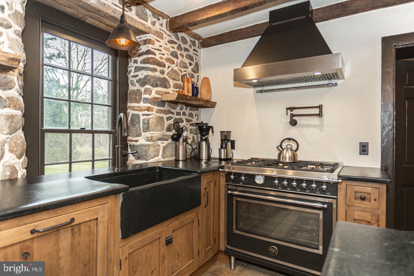2 Woodhill Road Newtown, PA 18940 - Photo 15 of 58 a kitchen with stainless steel appliances granite countertop a stove and a sink