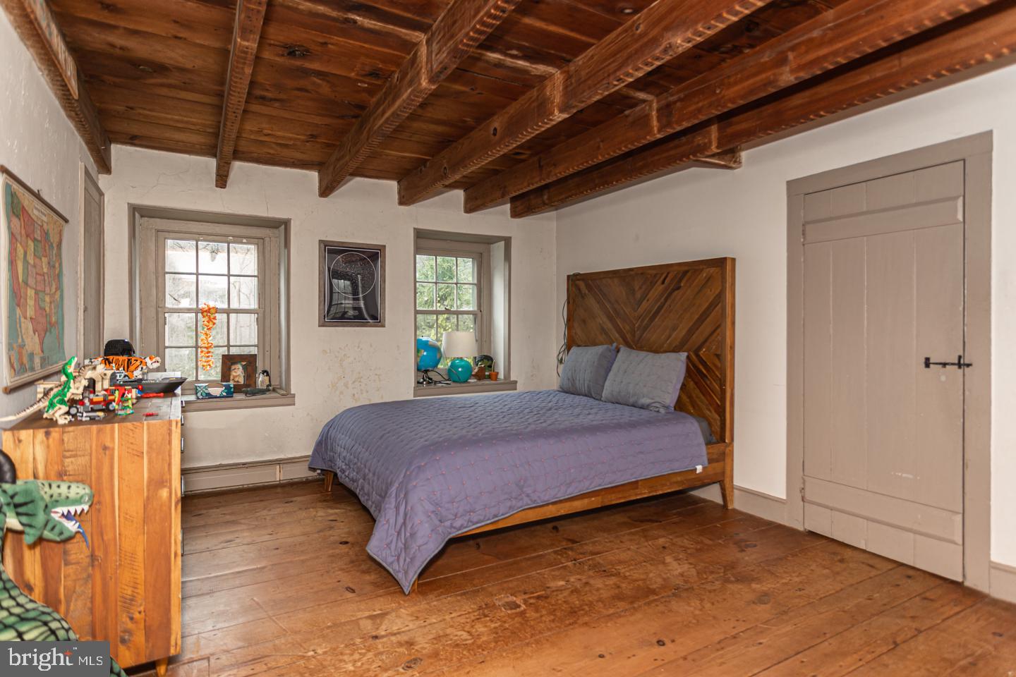 2 Woodhill Road Newtown, PA 18940 - Photo 21 of 58 a spacious bedroom with a bed and a chandelier