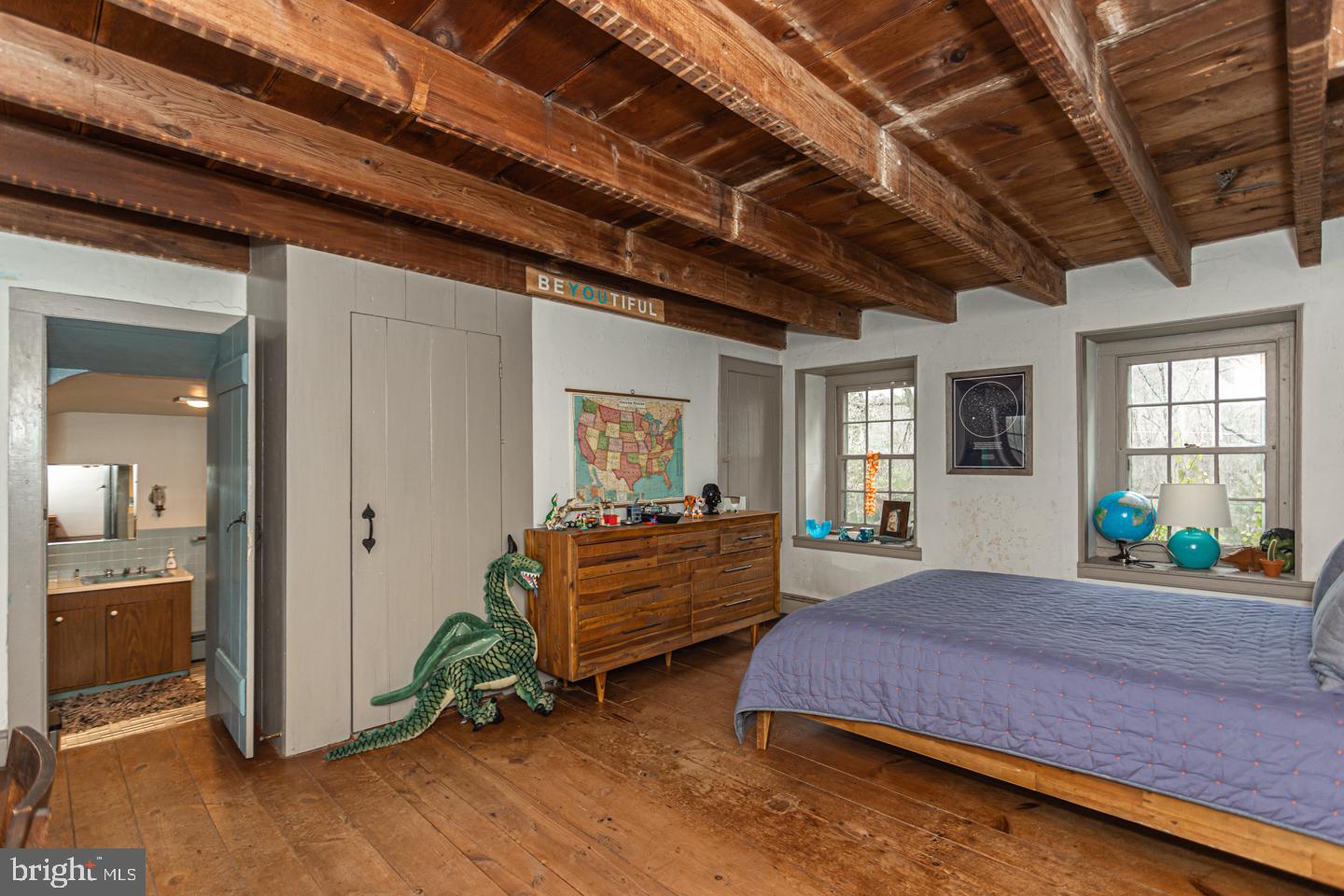 2 Woodhill Road Newtown, PA 18940 - Photo 22 of 58 a bedroom with a bed and wooden floor