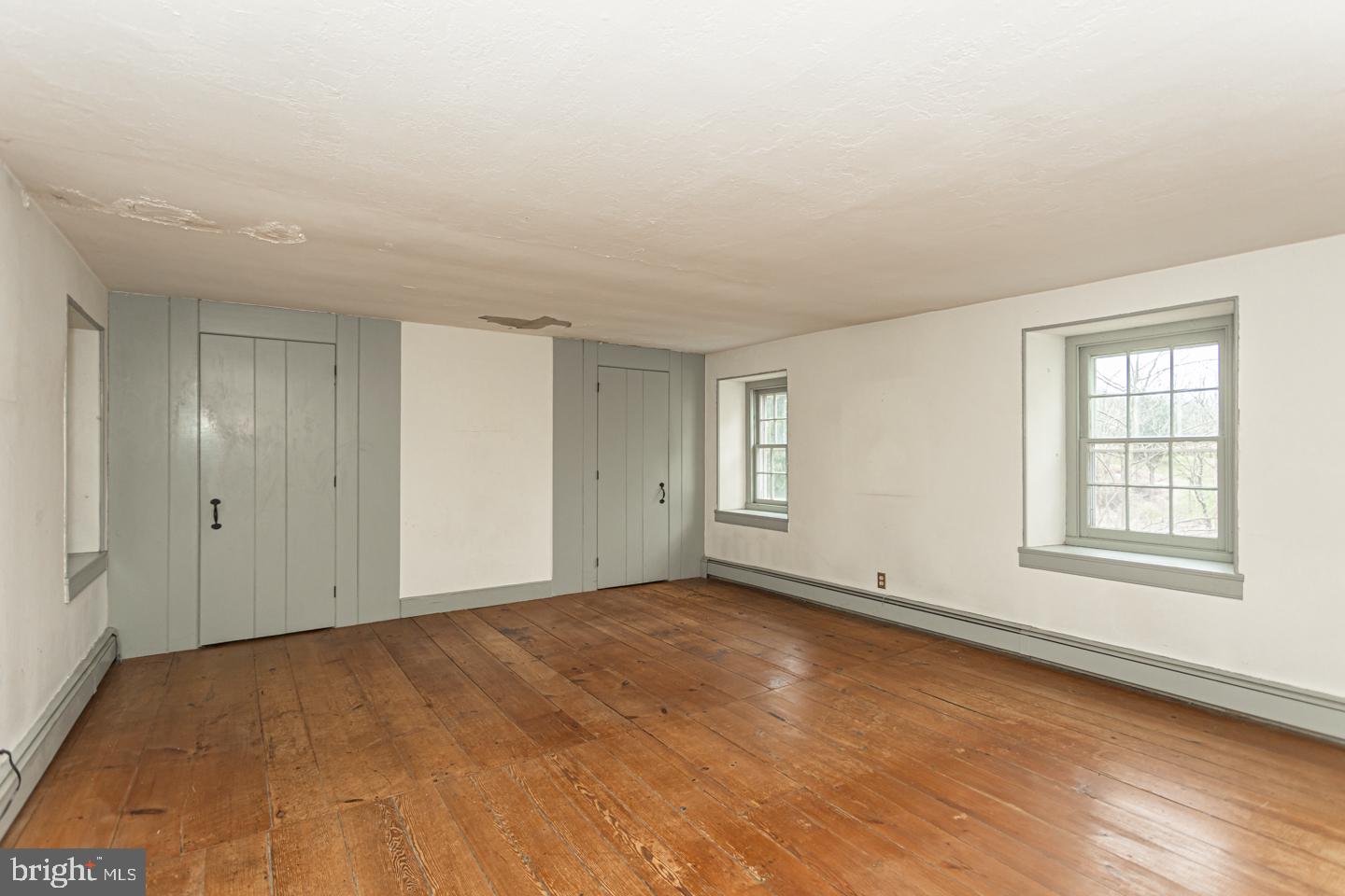 2 Woodhill Road Newtown, PA 18940 - Photo 26 of 58 a view of an empty room with wooden floor and a window