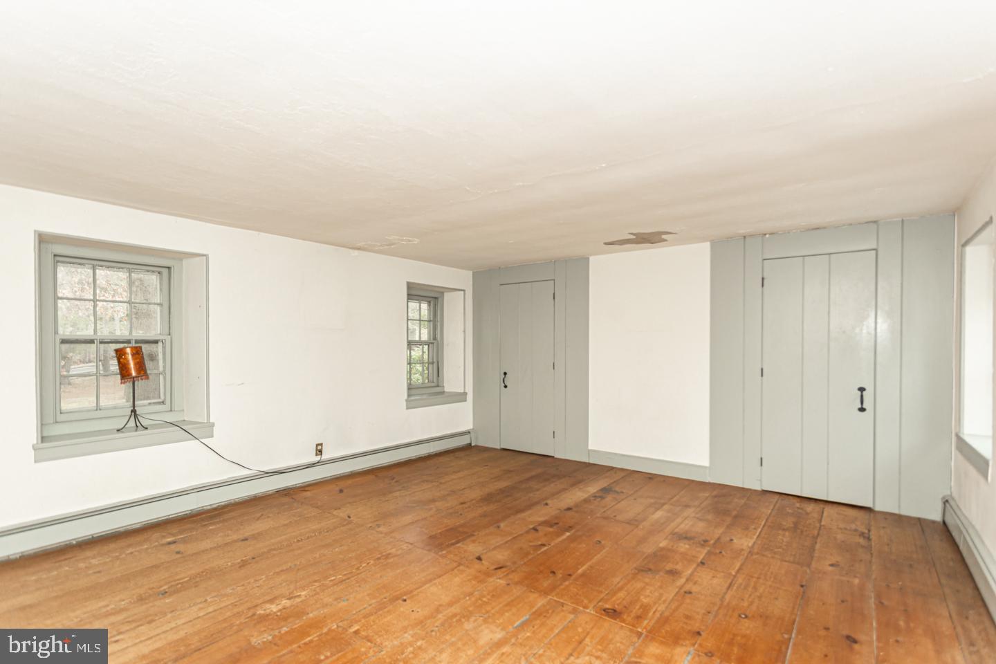 2 Woodhill Road Newtown, PA 18940 - Photo 27 of 58 an empty room with sliding door and wooden floor