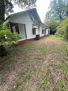 1954 Clark Road Lillington, NC 27546 - Photo 2 of 6 a house with a yard