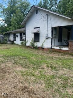1954 Clark Road Lillington, NC 27546 - Photo 3 of 6 a front view of a house with a yard