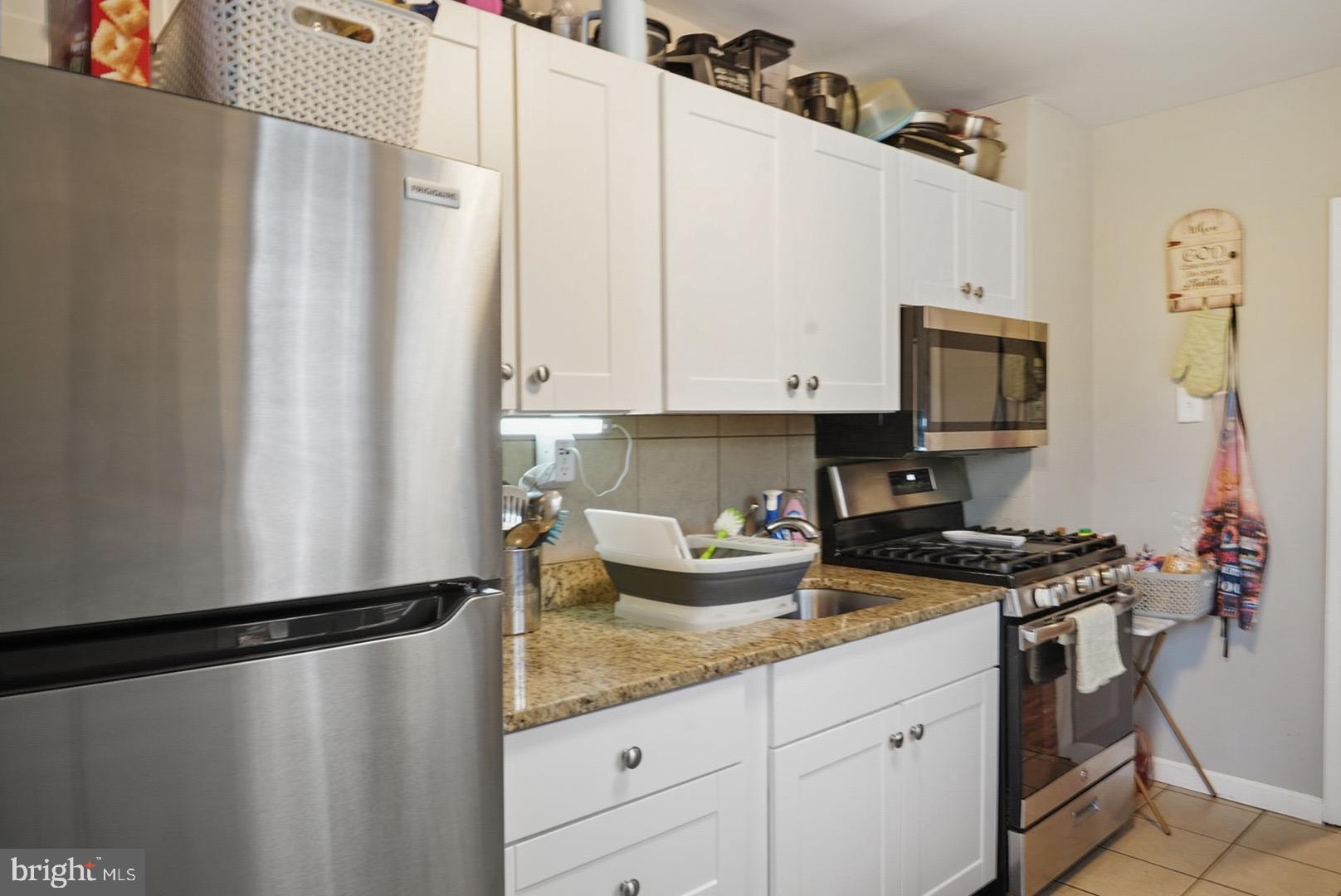 859 Cattell Road Wenonah, NJ 08090 - Photo 5 of 24 a kitchen with appliances a sink and cabinets