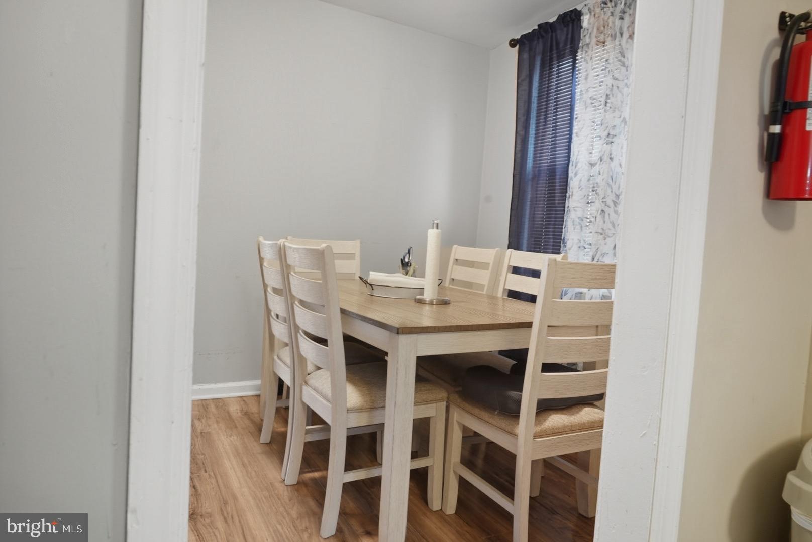 859 Cattell Road Wenonah, NJ 08090 - Photo 7 of 24 a view of a dining room with furniture and wooden floor