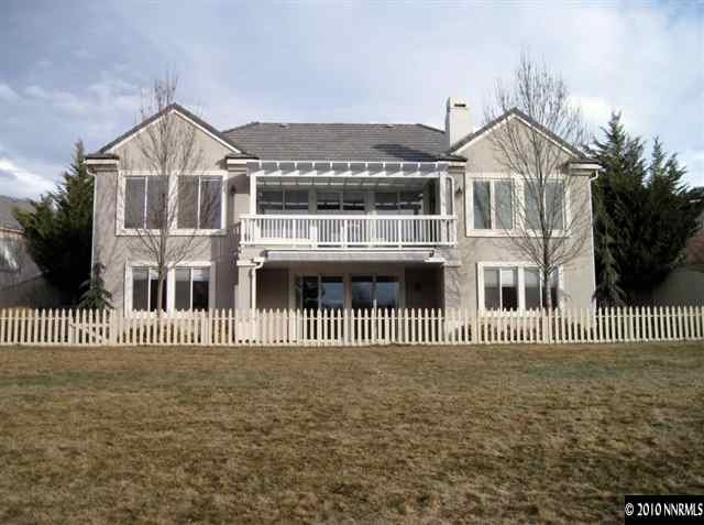 1697 Aspen Creek Road Reno, NV 89519 - Photo 1 of 9 a front view of a house with a garden