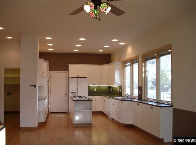 1697 Aspen Creek Road Reno, NV 89519 - Photo 2 of 9 a open kitchen with stainless steel appliances granite countertop a refrigerator and a sink
