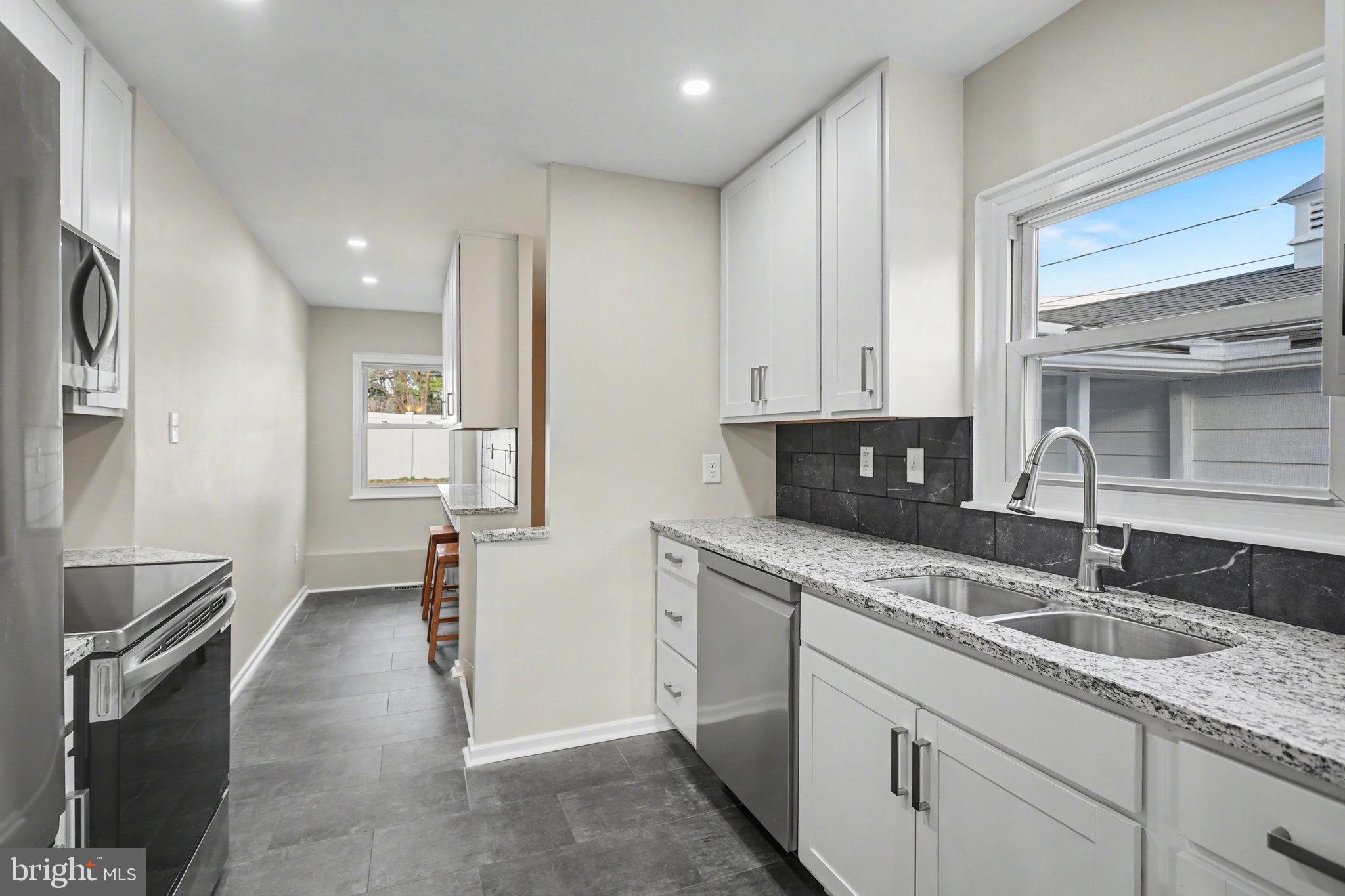 1402 Warwick Road Camp Hill, PA 17011 - Photo 12 of 36 a kitchen with a sink and cabinets