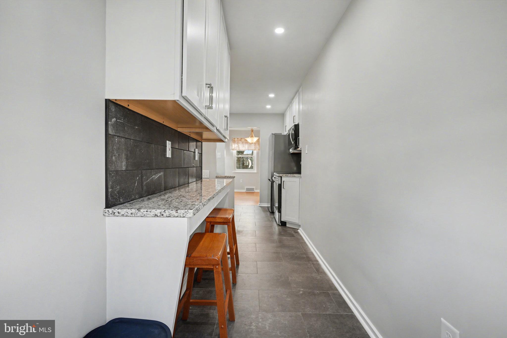 1402 Warwick Road Camp Hill, PA 17011 - Photo 15 of 36 a view of a hallway with a couch