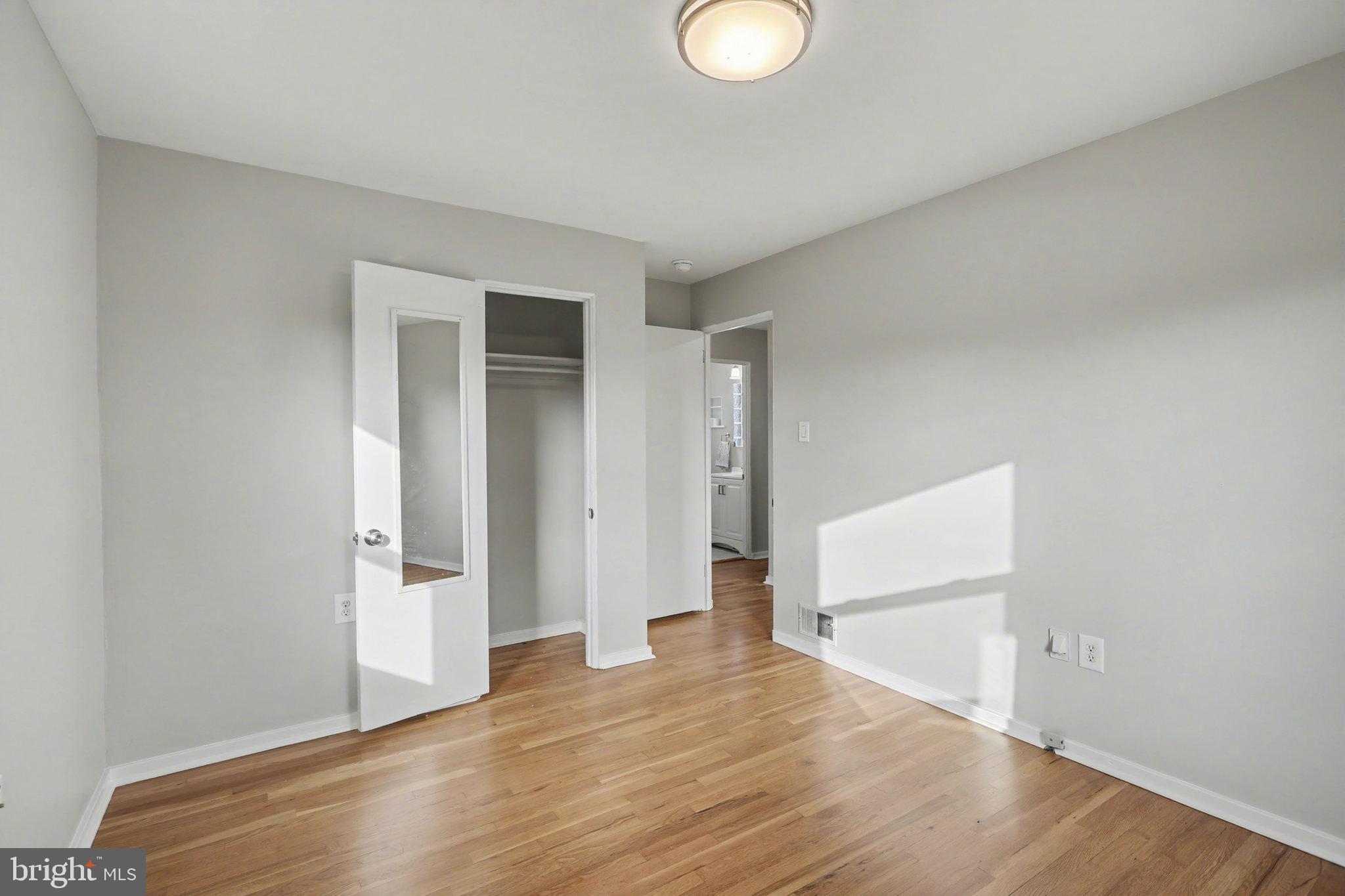 1402 Warwick Road Camp Hill, PA 17011 - Photo 17 of 36 a view of empty room with wooden floor