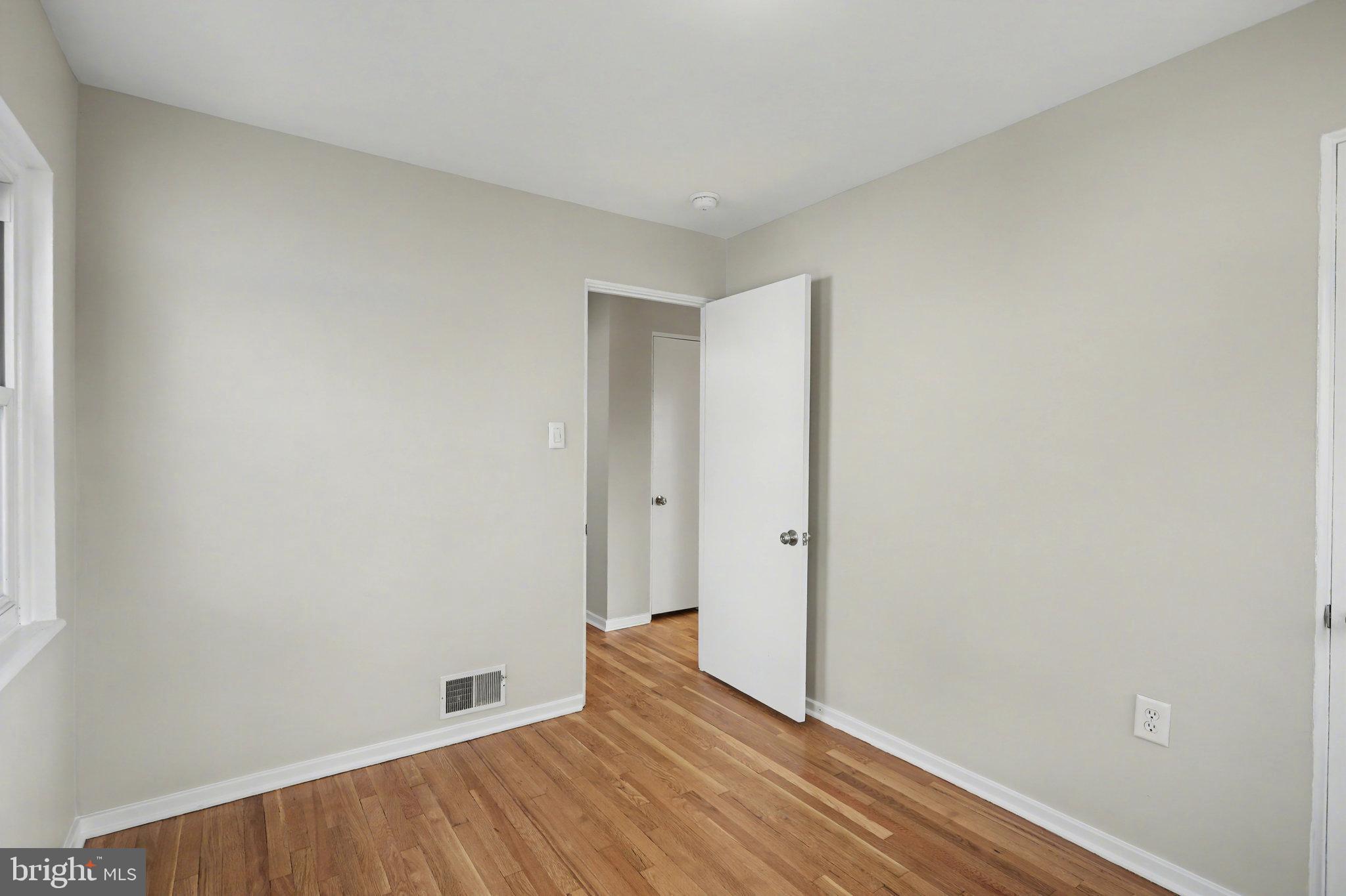 1402 Warwick Road Camp Hill, PA 17011 - Photo 20 of 36 a view of an empty room with wooden floor