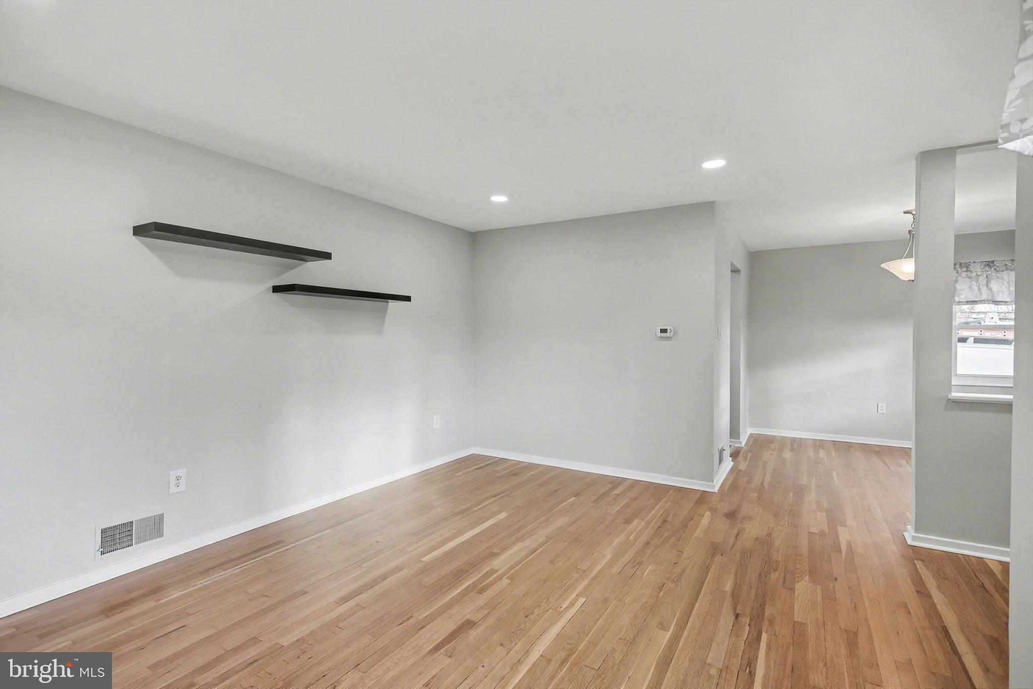 1402 Warwick Road Camp Hill, PA 17011 - Photo 7 of 36 a view of empty room with wooden floor