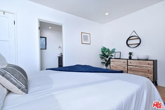 a bedroom with a bed and closet