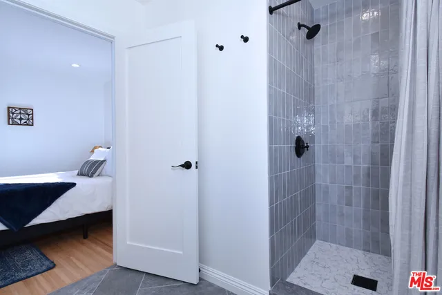 a bathroom with a sink and shower