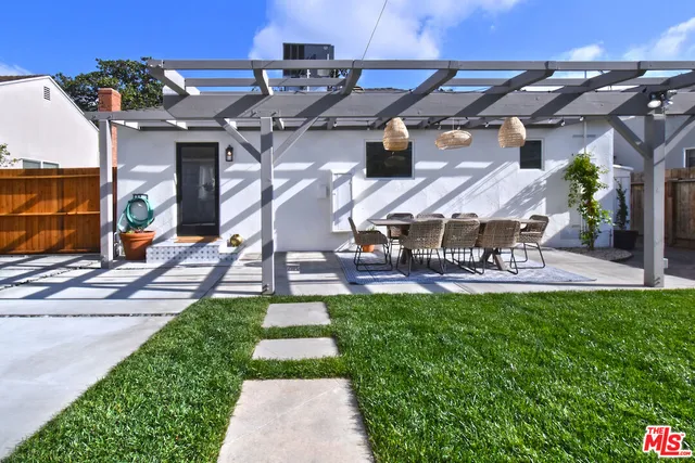 a view of a backyard with a patio