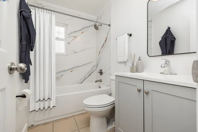 a bathroom with a toilet sink and shower
